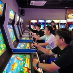 Players enjoying an engaging game bắn cá đổi thưởng at a colorful arcade, showcasing interactive gameplay and excitement.